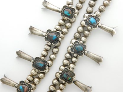 Close-up of Bisbee Turquoise Squash Blossom Necklace